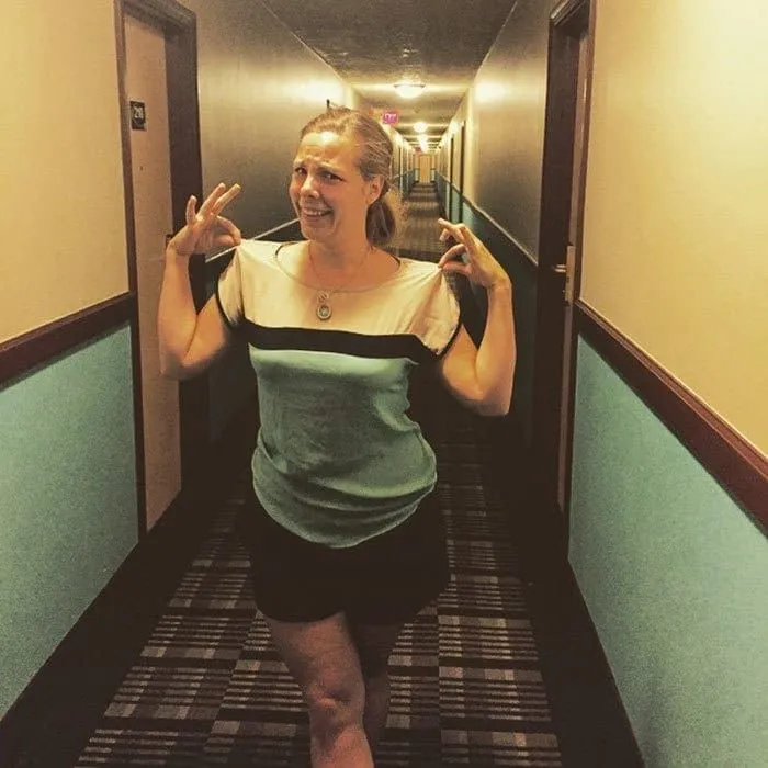 Girl vs. a hotel corridor
